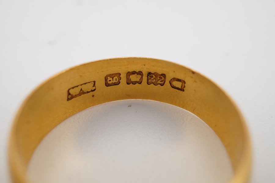 Two 22ct gold wedding bands, one 2.5mm, size K1/2, the other 6mm, size P, each with British hallmarks, combined gross weight approximately 6.5 grams